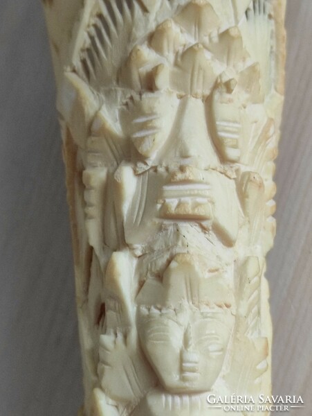 Totem sculpture carved from deer leg bone