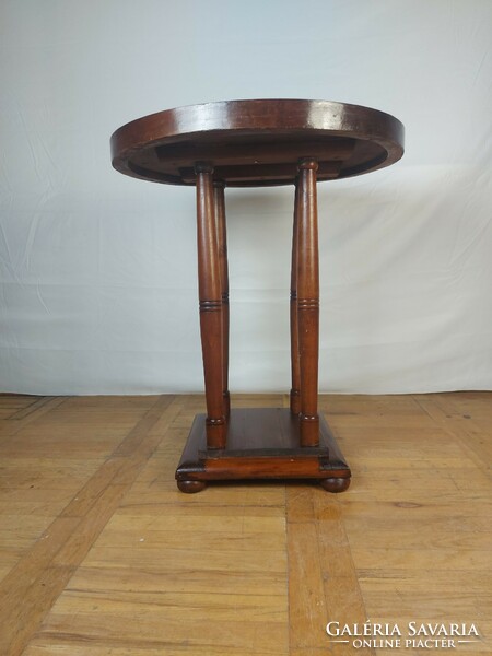 Art Nouveau round table with storage