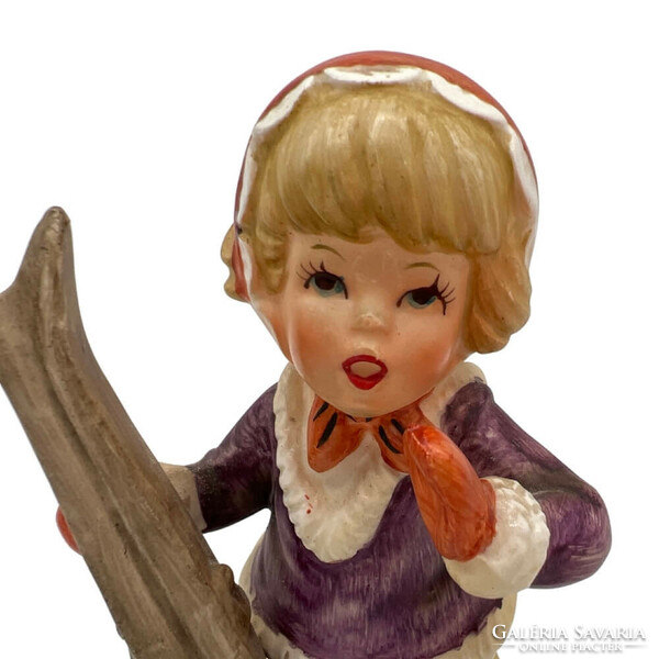 Little girl with porcelain skis m00710