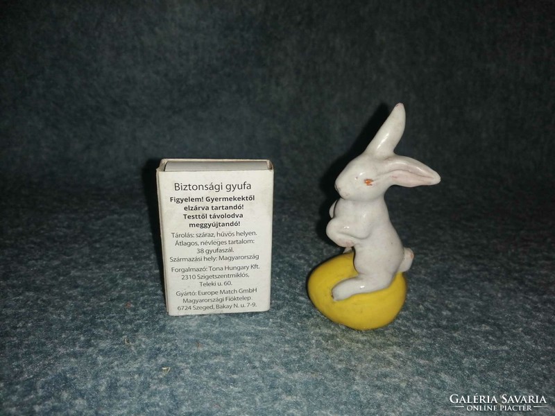 Glazed ceramic bunny on egg