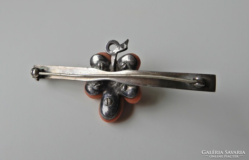 Silver brooch decorated with antique coral beads