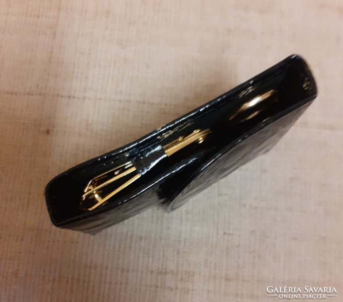 Old gold-plated travel manicure set in a black case