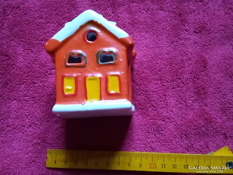 Christmas ceramic cottage with candles
