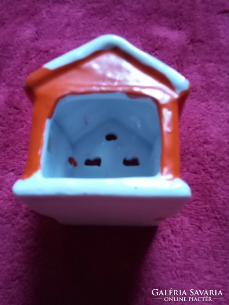 Christmas ceramic cottage with candles