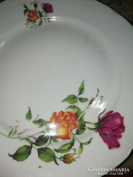 The pink porcelain plate is in the condition shown in the pictures