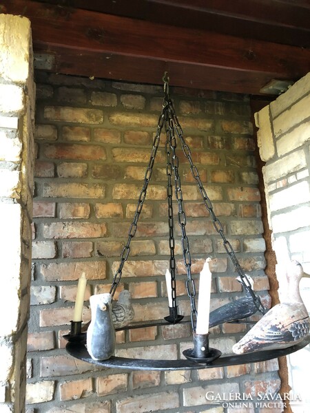 Particularly unique antique wrought iron candle holder chandelier