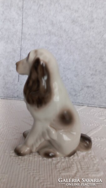 Ravenclaw porcelain sitting dog, marked, 14.5 x 12.3 x 5.5 cm