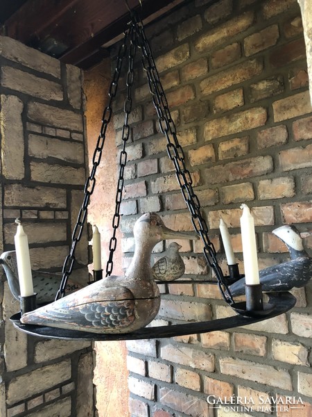 Particularly unique antique wrought iron candle holder chandelier