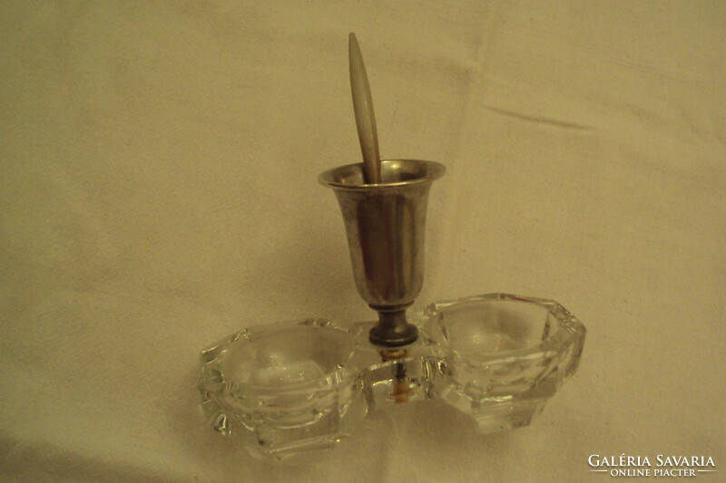A pair of spice holders (salt holders) made of cast glass, with a silver-plated spoon holder in the middle and a spoon with a small bone handle.