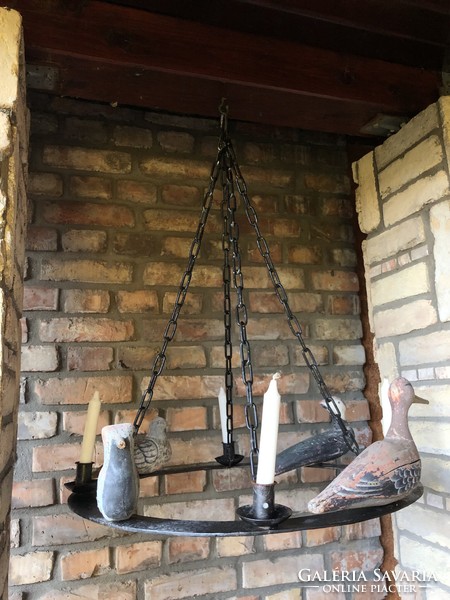 Particularly unique antique wrought iron candle holder chandelier