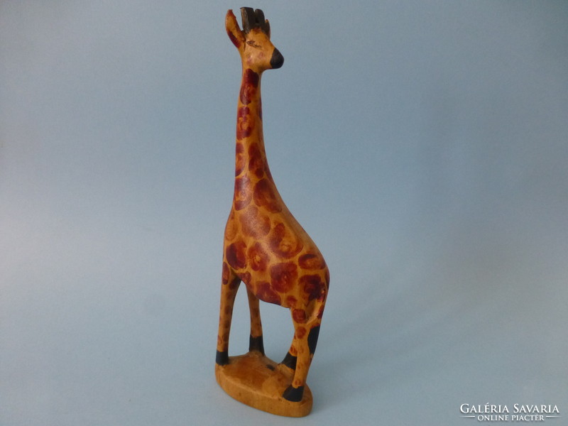 Carved wooden giraffe statue