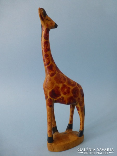 Carved wooden giraffe statue