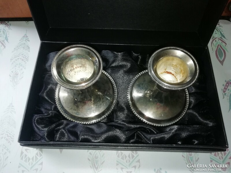 A pair of candle holders in a gift box, silver-plated
