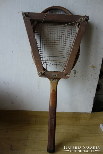 Antique wooden tennis racket with tensioner