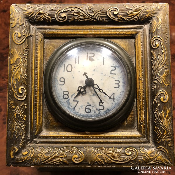 Table clock with an antique effect, built in a wooden box