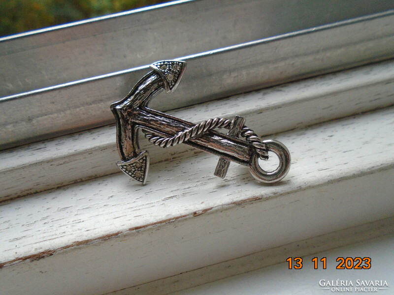 Brand new silver-plated anchor brooch with small polished stones