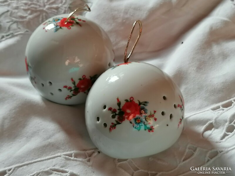 Pair of porcelain flowery, decorative perfume balls.