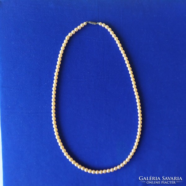 Vintage ecru string of pearls for sale!