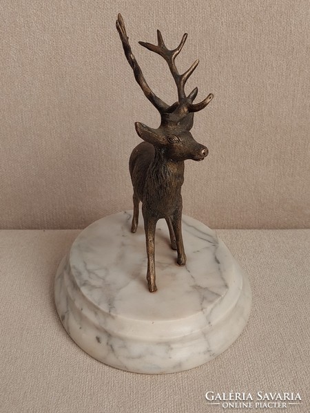 Old bronze deer statue on a marble base in perfect condition