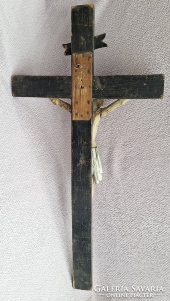 Antique wooden cross with Jesus crucified