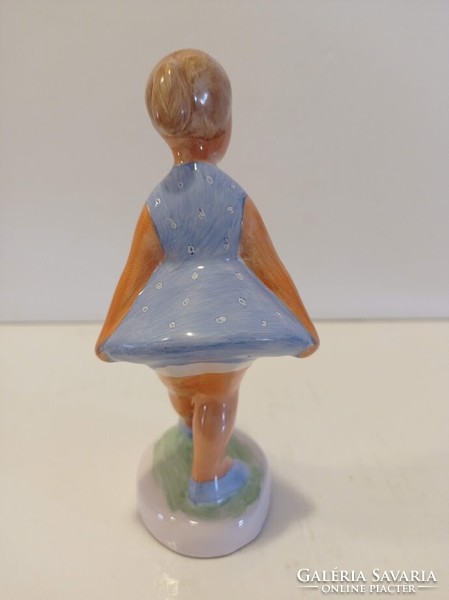 Ceramic little girl in a turquoise blue dress