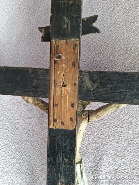 Antique wooden cross with Jesus crucified