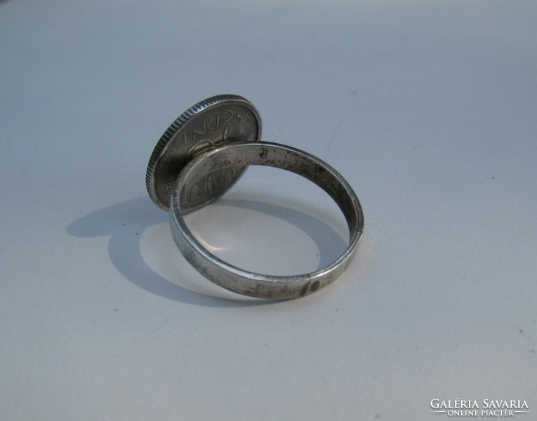 Old silver ring with silver coin