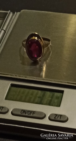 Large gold ring with a ruby-colored stone, very beautiful, serious women's