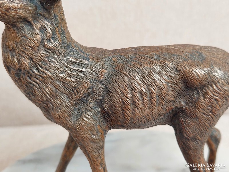 Old bronze deer statue on a marble base in perfect condition