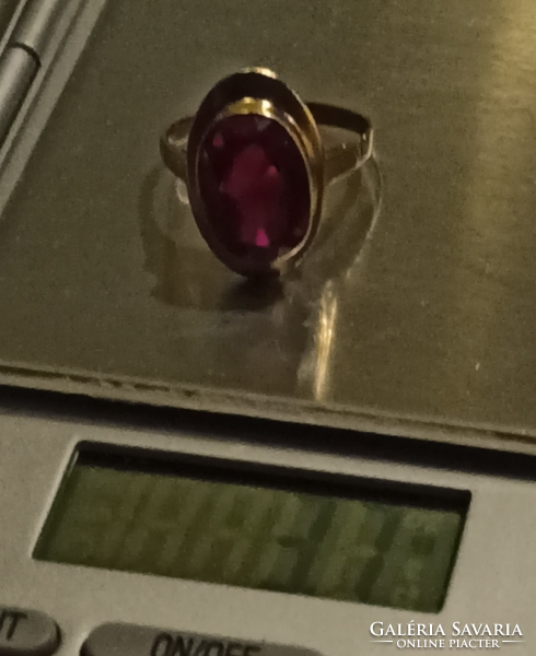 Large gold ring with a ruby-colored stone, very beautiful, serious women's