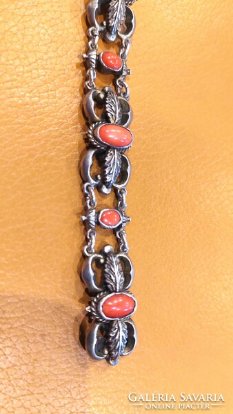 Old silver bracelet with coral decoration