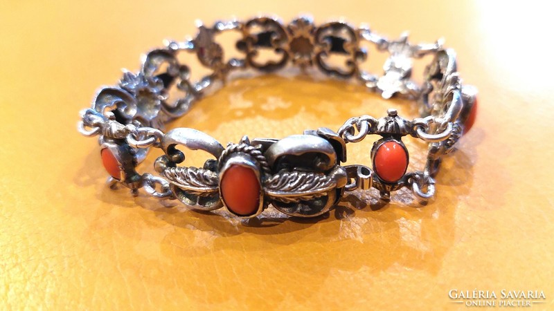 Old silver bracelet with coral decoration