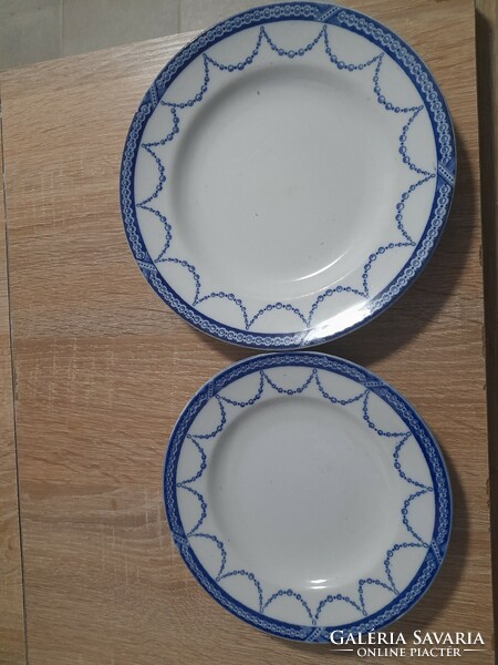 2 small plates with the label Bradford Copeland