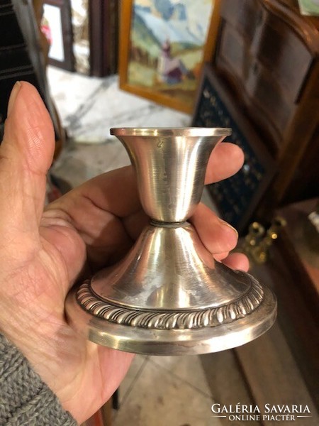 Pair of silver candle holders, marked, height 8 cm