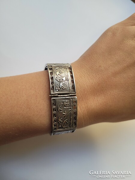 Antique Vietnamese 900 silver bracelet with filigree, plant, house and sea motifs can be expanded with extra eyes!