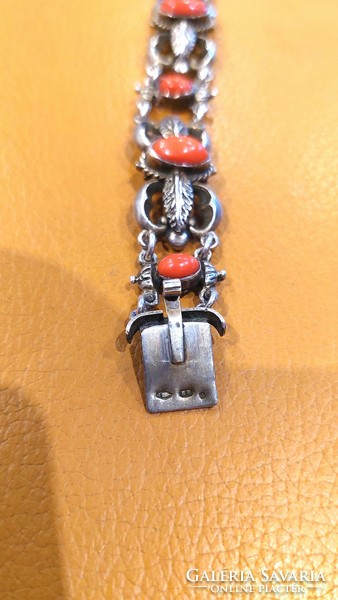 Old silver bracelet with coral decoration