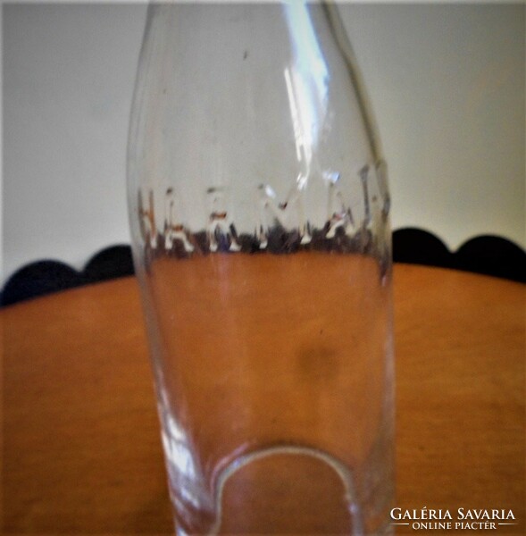 Old small mineral water bottle of dew water + calculation slip