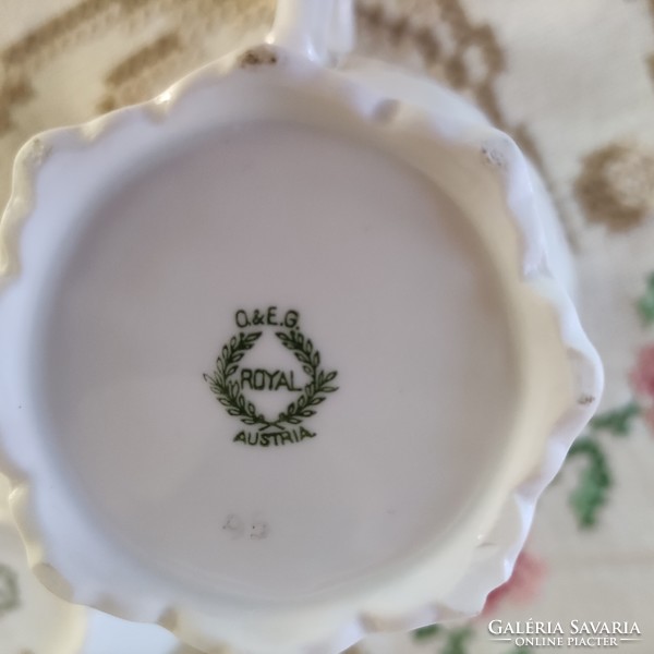 Pieces of a tea set with a wild rose pattern