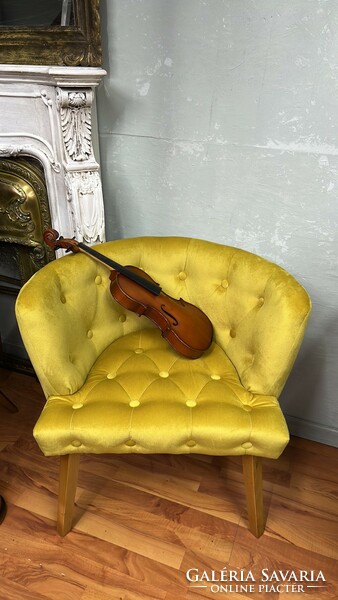 Style upholstered armchair with yellow stitched upholstery on all sides
