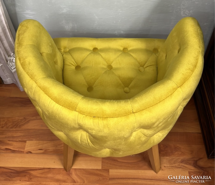 Style upholstered armchair with yellow stitched upholstery on all sides