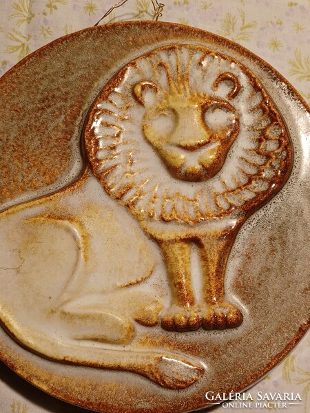 Applied art glazed ceramic wall picture with a lion