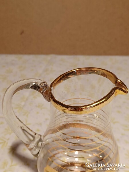 Small glass jug with gold stripes