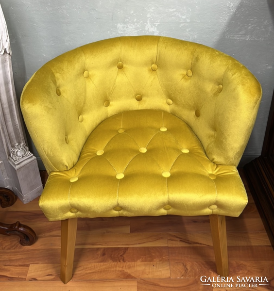 Style upholstered armchair with yellow stitched upholstery on all sides