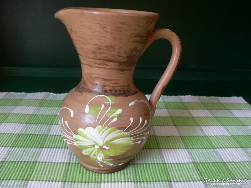 Old earthenware jug with handle