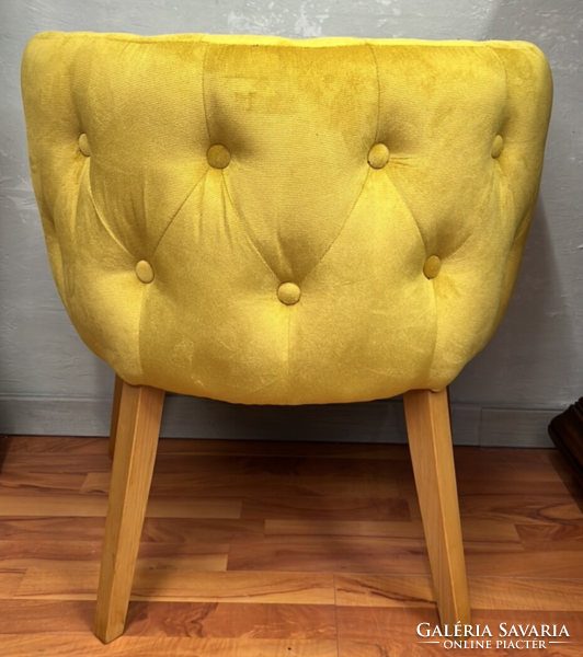 Style upholstered armchair with yellow stitched upholstery on all sides