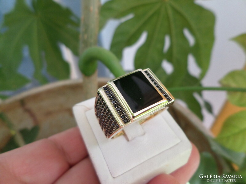Modern gold men's ring with black stones
