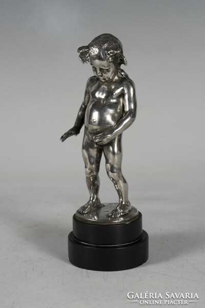 Silver child figure