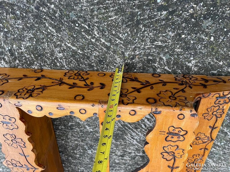 Beautiful wooden shelf richly patterned