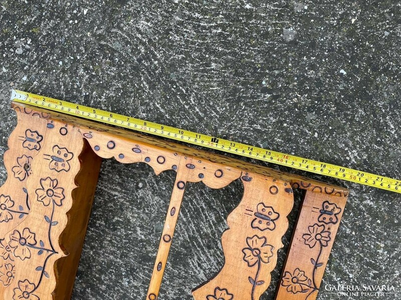 Beautiful wooden shelf richly patterned