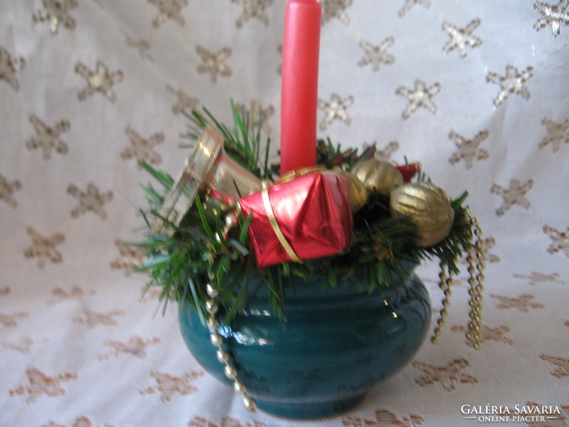 Christmas table decoration in a green ceramic pot